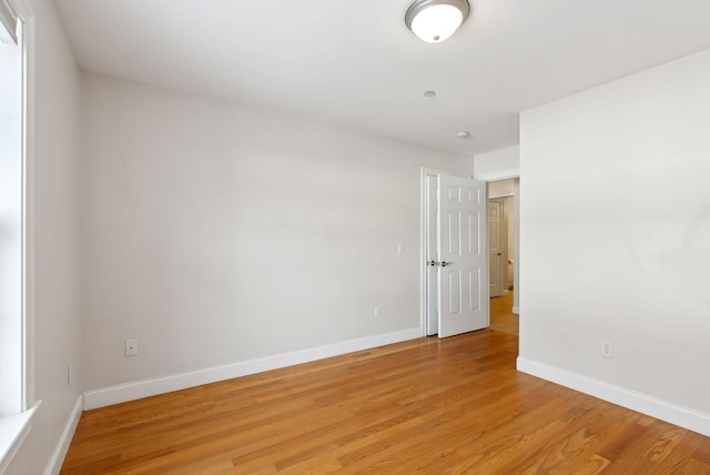 unfurnished room featuring light wood-type flooring