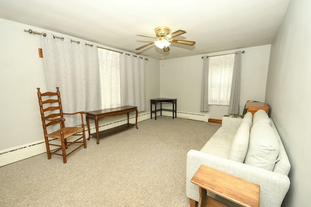 living area with carpet floors and ceiling fan