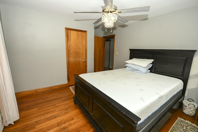 bedroom featuring ceiling fan and wood-type flooring