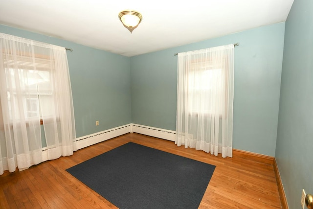 unfurnished room with hardwood / wood-style floors