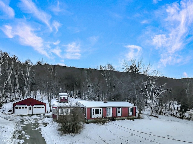 exterior space featuring an outbuilding, central AC unit, and a garage