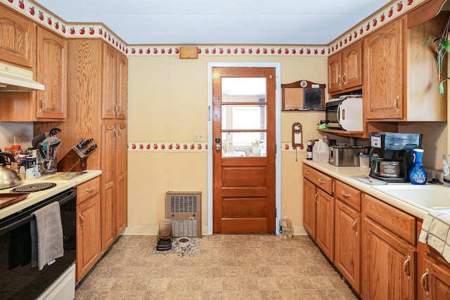 kitchen featuring white range with electric cooktop and sink