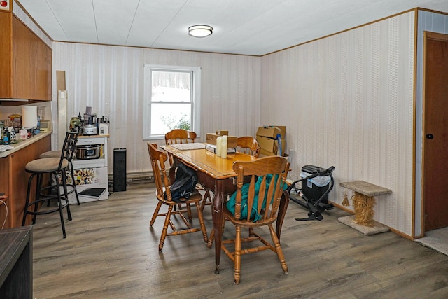 dining space with dark hardwood / wood-style floors