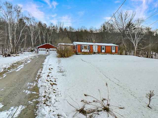 view of front of home featuring an outbuilding and a garage