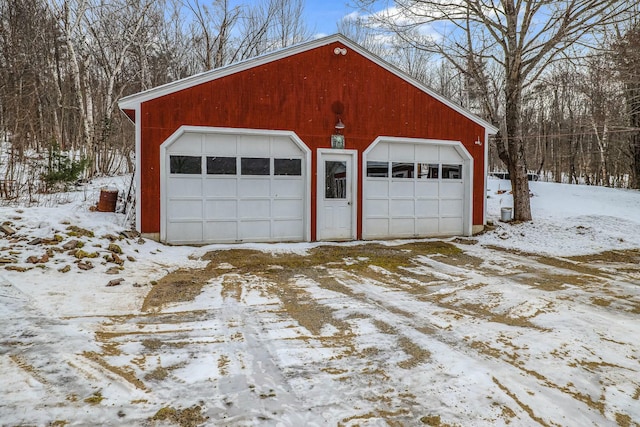 view of snow covered garage