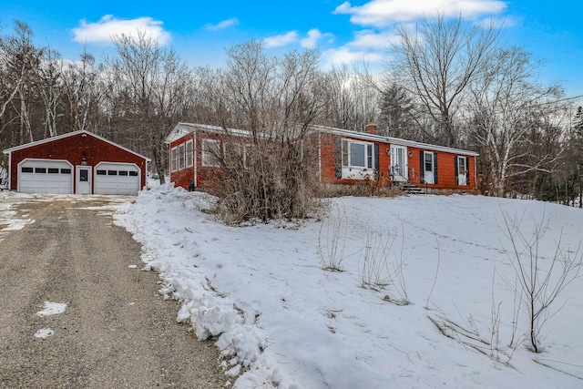 view of front of property featuring an outbuilding and a garage