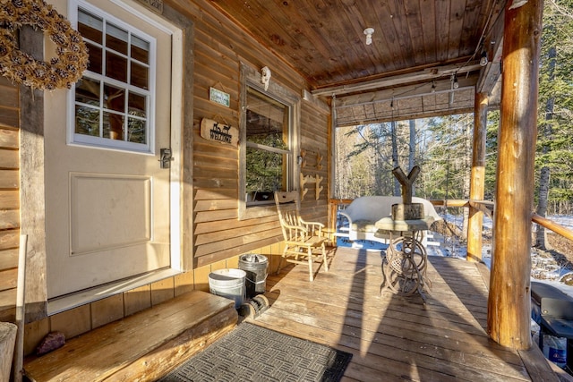 wooden deck featuring covered porch