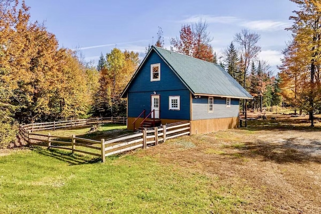 view of outbuilding with a lawn