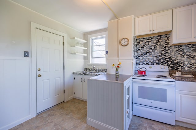 kitchen with a sink, open shelves, white cabinets, and white electric stove