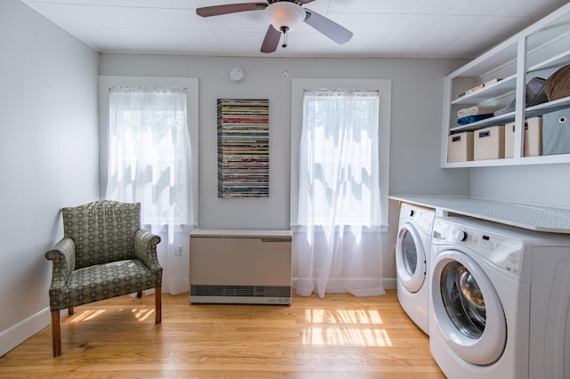 laundry area featuring laundry area, plenty of natural light, separate washer and dryer, and light wood finished floors