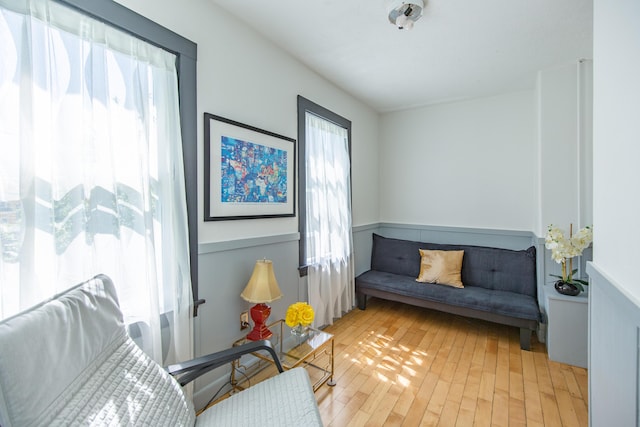 sitting room with light wood-style floors