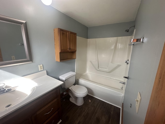 full bathroom featuring toilet, tub / shower combination, vanity, and hardwood / wood-style floors