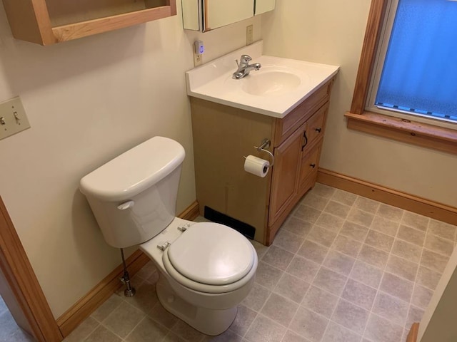 bathroom with toilet and vanity