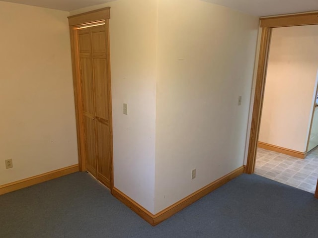 unfurnished room featuring carpet flooring