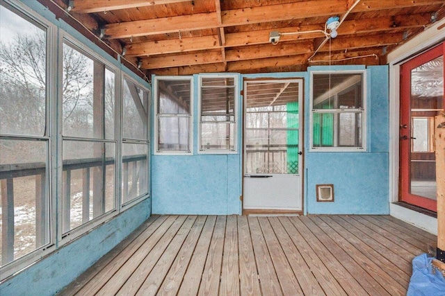 unfurnished sunroom with wood ceiling and lofted ceiling with beams