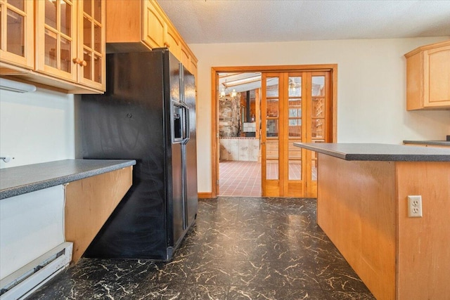 kitchen featuring black fridge, light brown cabinetry, french doors, and a textured ceiling