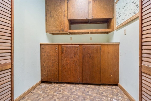 kitchen featuring dark parquet flooring