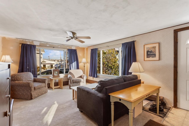 living room with a wealth of natural light and ceiling fan