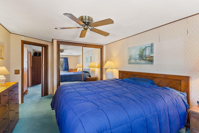 carpeted bedroom with crown molding, ceiling fan, and a closet