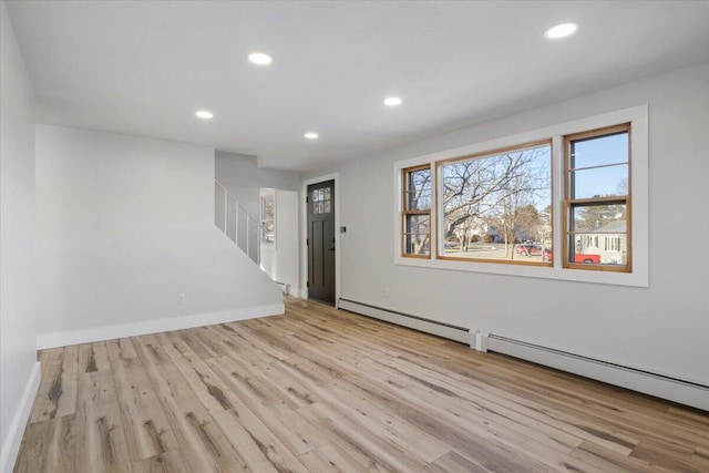 unfurnished room with light hardwood / wood-style flooring