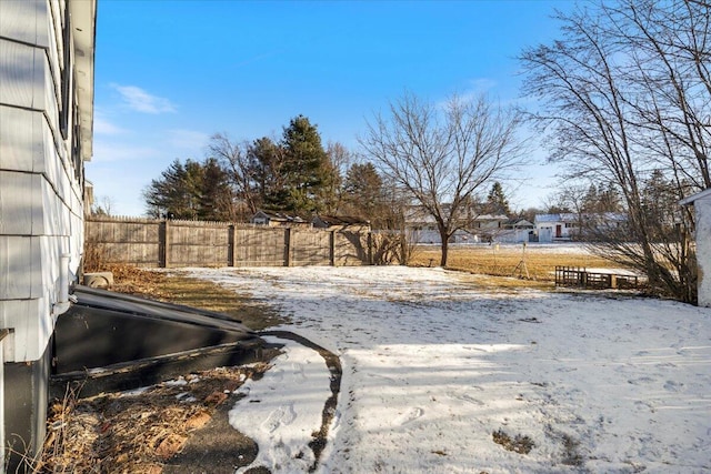 view of yard layered in snow