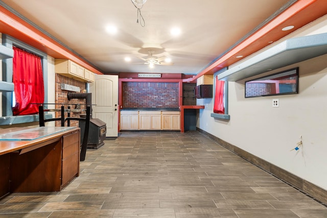 kitchen featuring ceiling fan and dark hardwood / wood-style floors