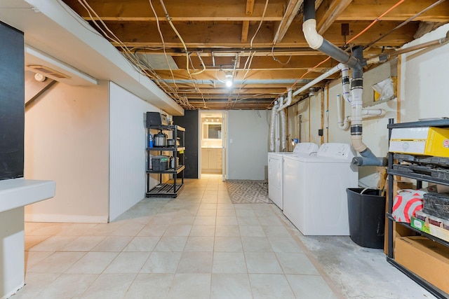 basement with separate washer and dryer