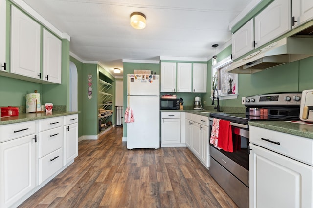 kitchen with white fridge, stainless steel electric range oven, white cabinets, and sink