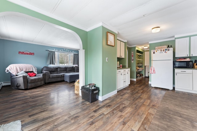 kitchen featuring white fridge, ornamental molding, dark hardwood / wood-style flooring, and white cabinetry