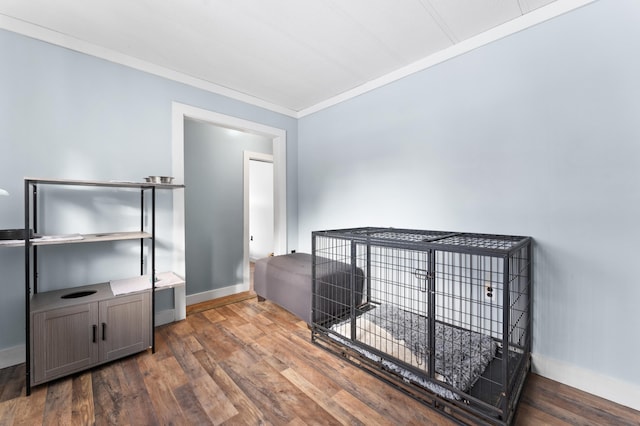 interior space with crown molding and dark hardwood / wood-style floors