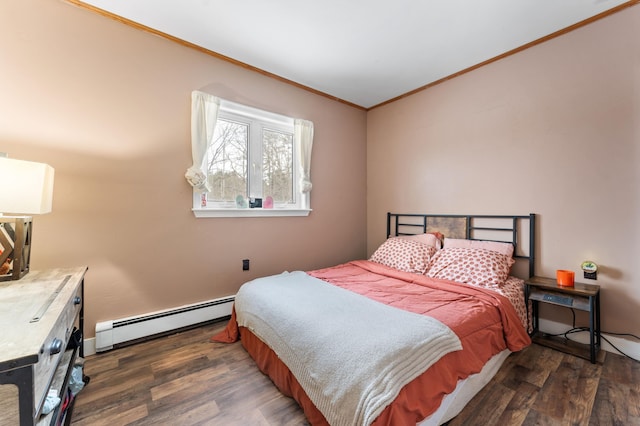 bedroom with a baseboard heating unit, crown molding, and dark hardwood / wood-style floors