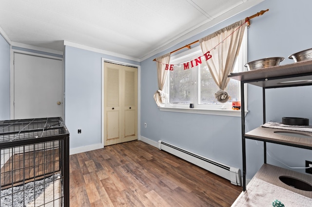 interior space featuring a baseboard radiator, ornamental molding, and dark hardwood / wood-style floors