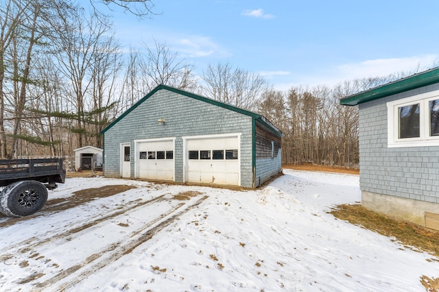 view of snow covered garage