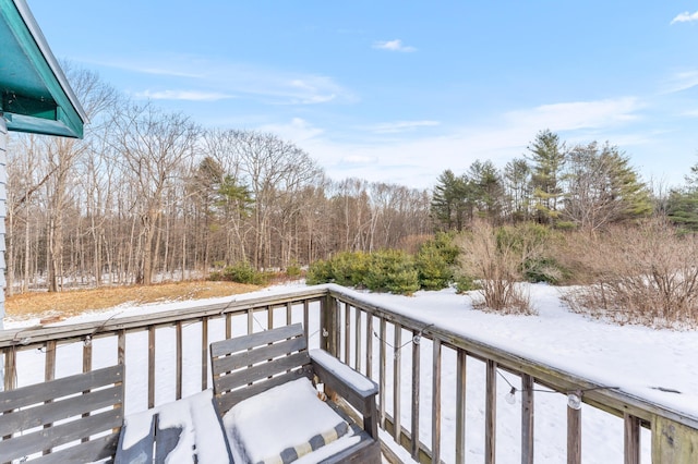 view of snow covered deck