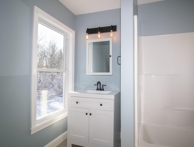 bathroom with a healthy amount of sunlight and vanity