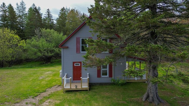 751 Kennedy Hwy, Milbridge, ME 04658 - rear view of house featuring a yard