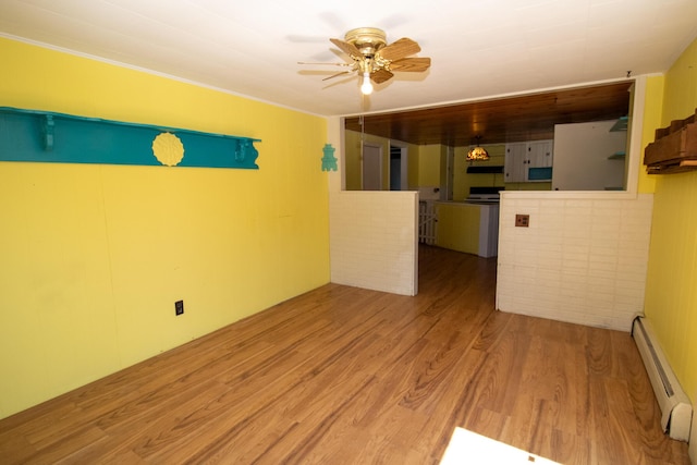 20 Cottage St, Milbridge, ME 04658 - unfurnished room with ceiling fan, a baseboard heating unit, and wood finished floors