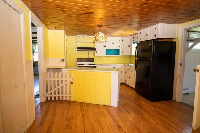 20 Cottage St, Milbridge, ME 04658 - kitchen featuring freestanding refrigerator, wood ceiling, white range with gas stovetop, and wood finished floors