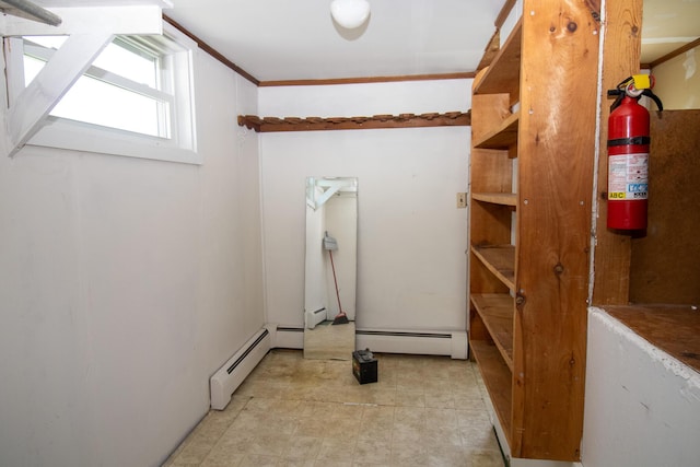 20 Cottage St, Milbridge, ME 04658 - laundry room with crown molding, a baseboard heating unit, and baseboard heating