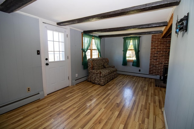 20 Cottage St, Milbridge, ME 04658 - unfurnished room featuring light wood-style flooring, a baseboard heating unit, baseboard heating, and beamed ceiling