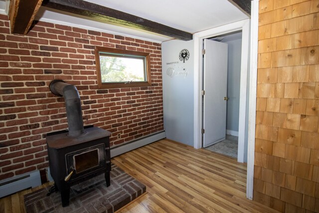 20 Cottage St, Milbridge, ME 04658 - interior space featuring beam ceiling, baseboard heating, and wood finished floors