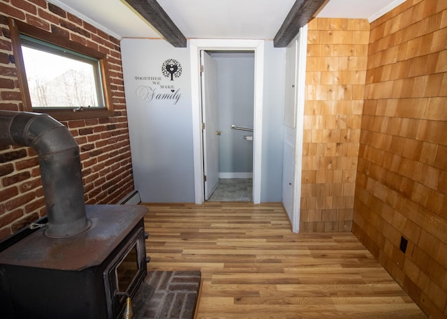 20 Cottage St, Milbridge, ME 04658 - hall with light wood-type flooring, beam ceiling, brick wall, and baseboard heating