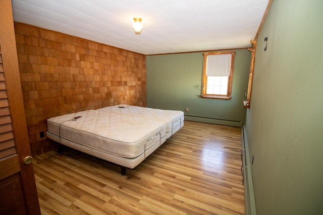 20 Cottage St, Milbridge, ME 04658 - bedroom with light wood-type flooring and a baseboard heating unit