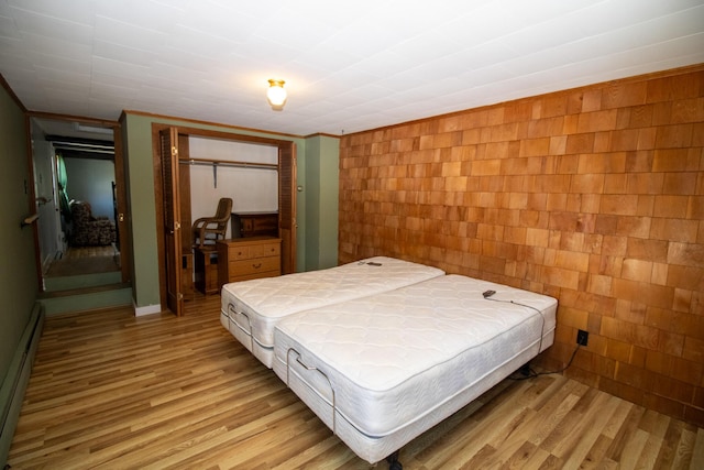20 Cottage St, Milbridge, ME 04658 - bedroom with a closet, light wood-style flooring, and baseboard heating