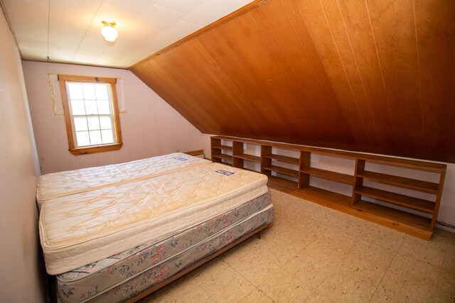 20 Cottage St, Milbridge, ME 04658 - bedroom featuring tile patterned floors and vaulted ceiling