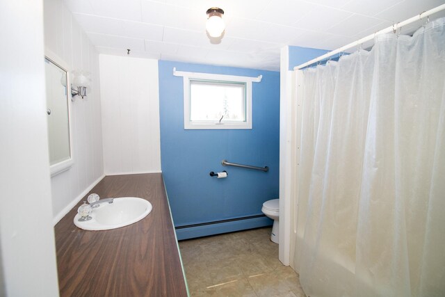 20 Cottage St, Milbridge, ME 04658 - full bath with baseboard heating, vanity, baseboards, toilet, and a shower with shower curtain