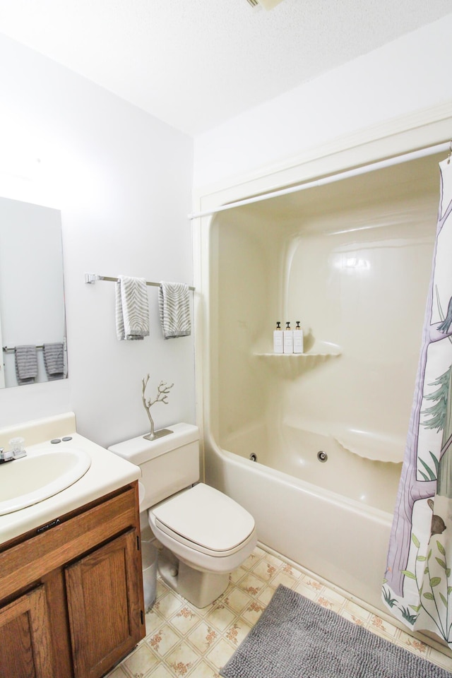 full bathroom featuring shower / bath combo, vanity, toilet, and tile patterned floors