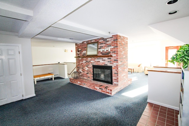 tiled living room with carpet, a fireplace, and baseboards