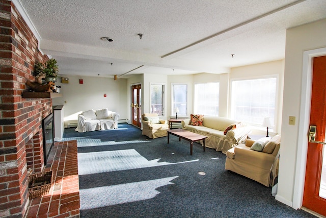 living area with carpet, a fireplace, baseboards, and a textured ceiling