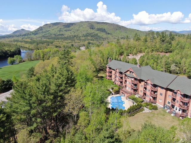 68 Chamberlain Way Unit 35-B, Hanover, ME 04237 - drone / aerial view of a water and mountain view, a forest, and a pool